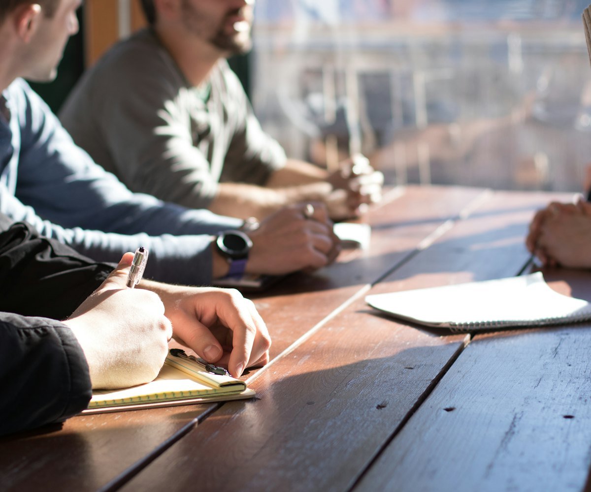 A team planning a corporate gifting programme around a boardroom table
